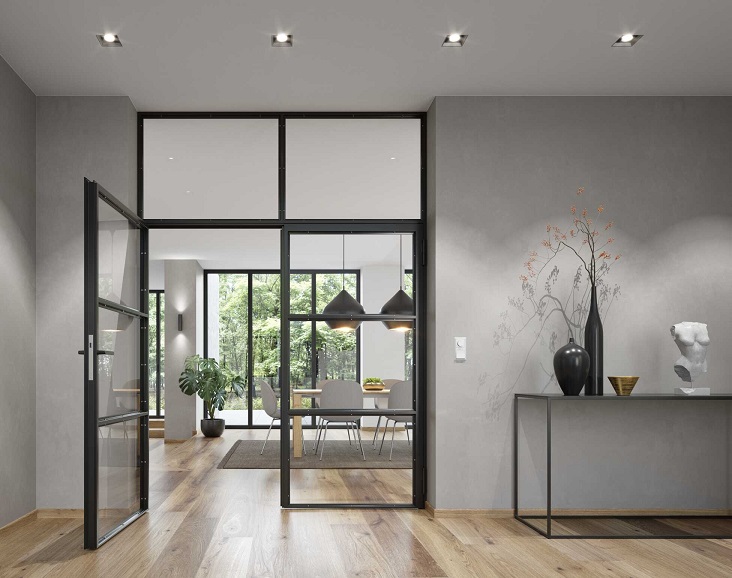 Doppelte Lofttür zwischen Raum und Wohnzimmer mit Esstisch in modern eingerichtetem Ambiente